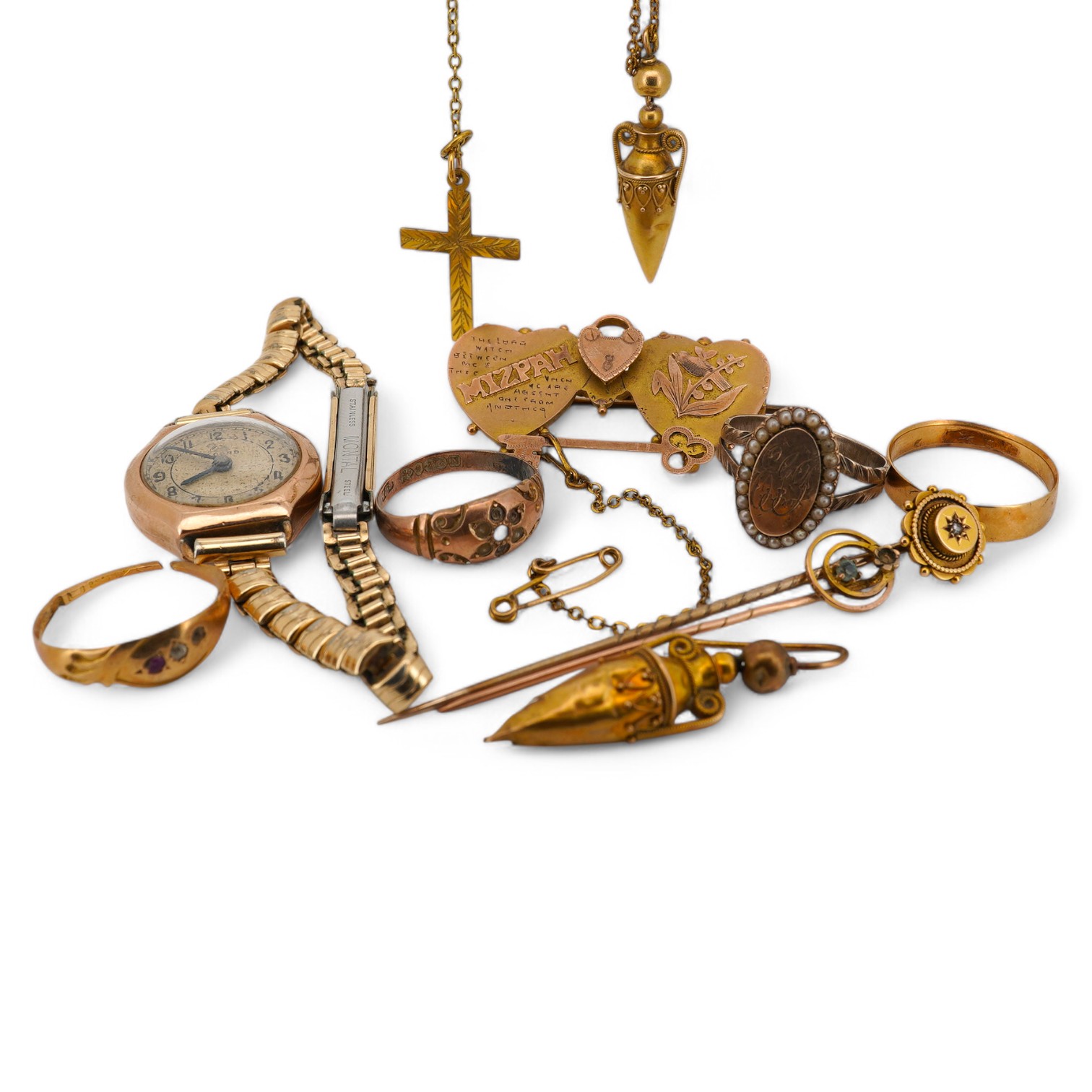 A group of jewels, comprising: a late 19th century 'Mizpah' brooch, stamped 9CT; a 9ct gold ring, British hallmark; a ruby and diamond ring, partial British hallmarks; a diamond stick pin, stamped 15CT, an aquamarine sti